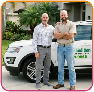 skip and his son standing next to company vehicle